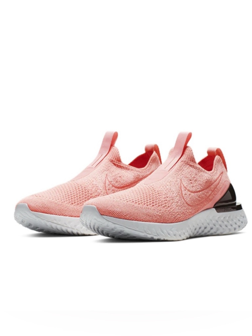 Nike Women’s Slip-On Flyknit Sneakers in Coral Pink and White